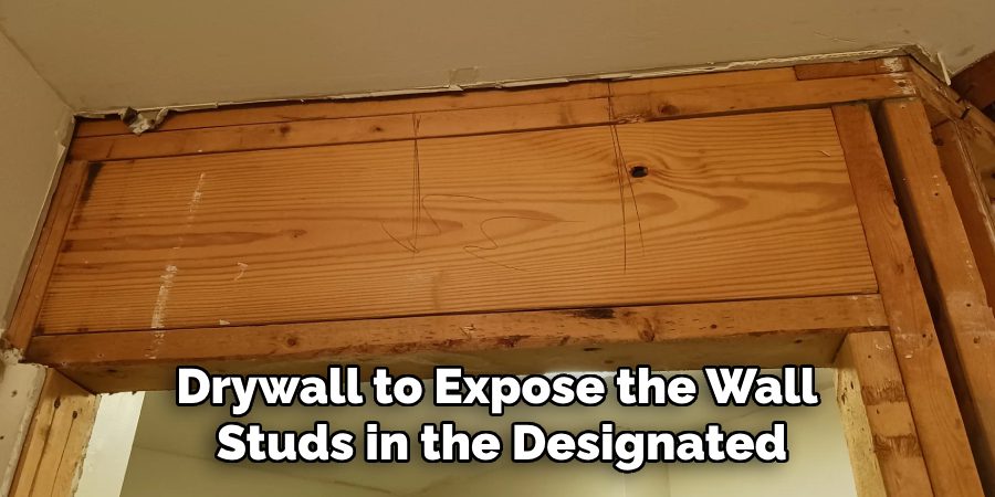 Drywall to Expose the Wall
Studs in the Designated