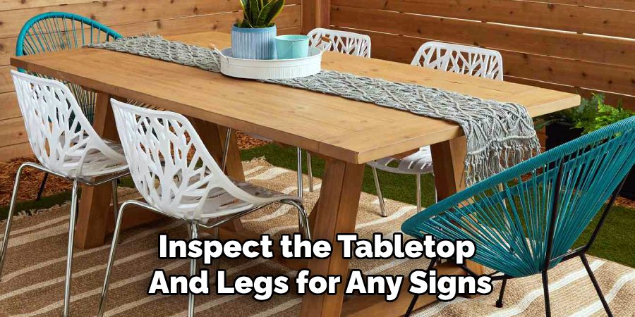Inspect the Tabletop
And Legs for Any Signs