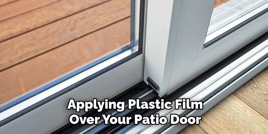 Applying Plastic Film Over Your Patio Door