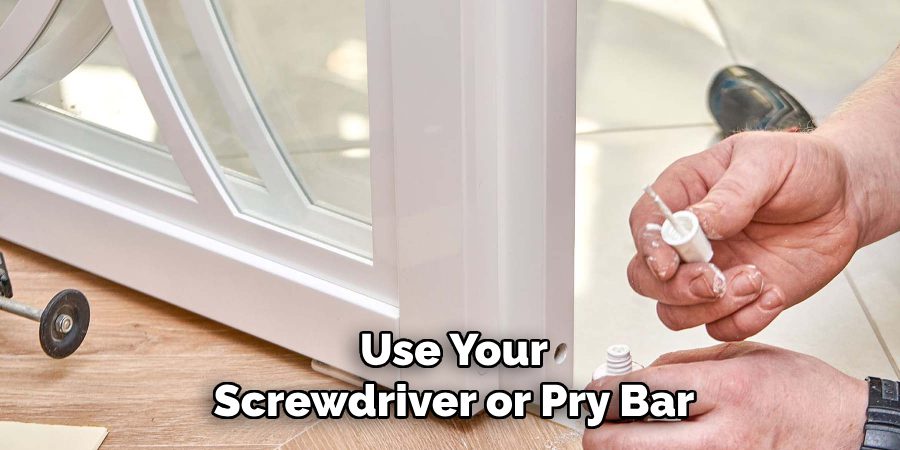 Use Your Screwdriver or Pry Bar