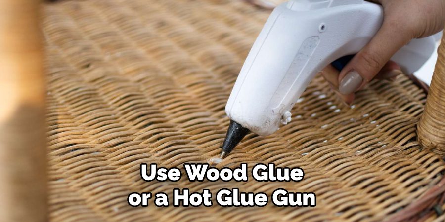 Use Wood Glue or a Hot Glue Gun