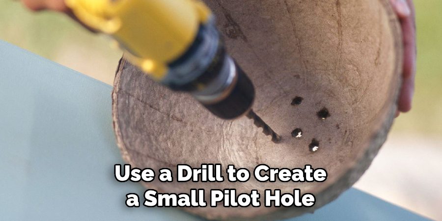 Use a Drill to Create a Small Pilot Hole